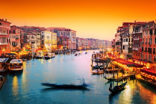 Venice, Italy. Gondola floats on Grand Canal at sunset