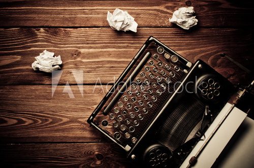 Vintage typewriter and a blank sheet of paper, retouching retro