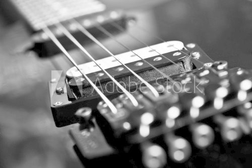 Strings electric guitar closeup in black tones