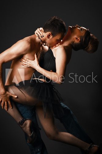 romantic tango dancing couple on black