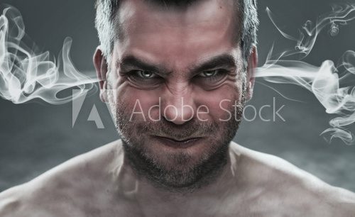 Close up of angry man with steam coming out from his ears