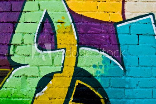 Graffity: Colorful detail on a textured brick wall