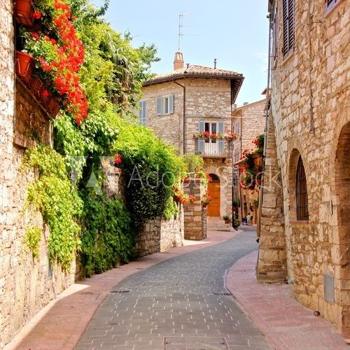 Flower lined street in the town of Assisi, Italy