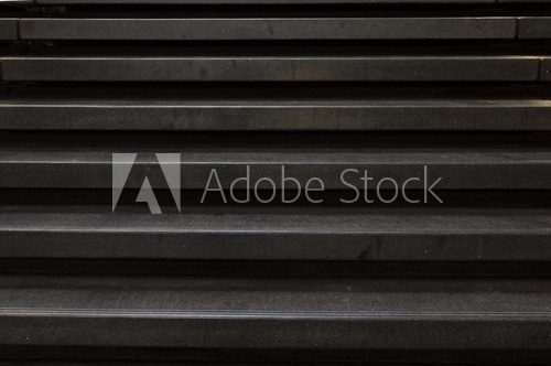Straight look at a black stone stair case