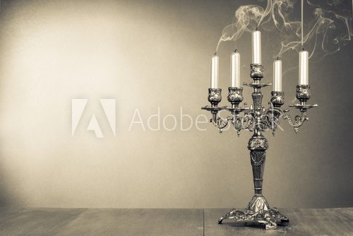 Vintage candelabrum with five reek candles sepia photo