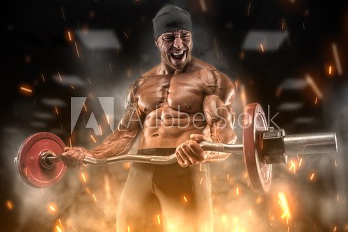 Angry athlete trains in the gym