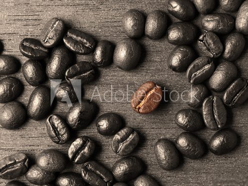 Coffee crop beans on wood texture background