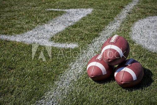 Footballs on a playing field