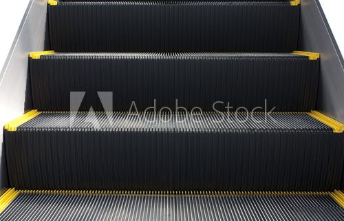 Escalator in close-up shot .Stairs are  rowed or lined things.