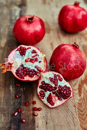 pomegranates on a dark wooden background