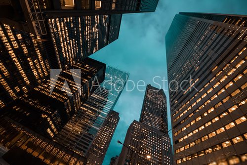 night view of Toronto city skyscrapers; look up;