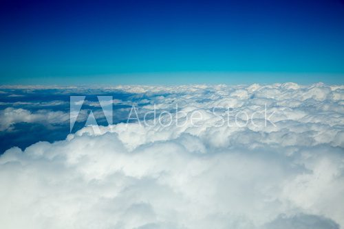 Aerial fluffy clouds view from high like a sea