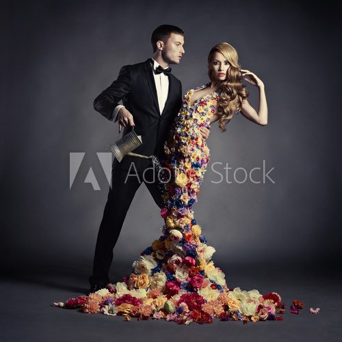 Young man and beautiful lady in flower dress