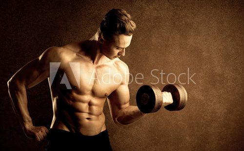 Muscular fit bodybuilder athlete lifting weight