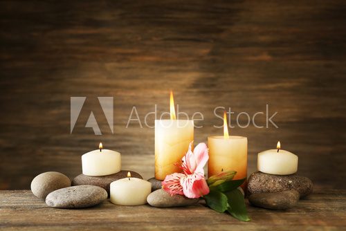 Beautiful composition with candles and spa stones