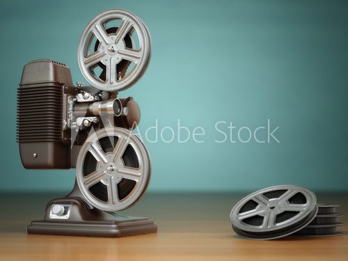 Video, cinema concept. Vintage film movie projector and reels on
