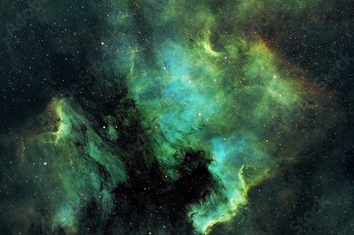 Beautiful space nebula of green color. Elements of this image were furnished by NASA.