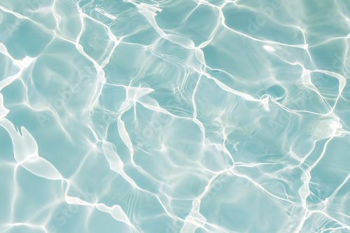 Texture of water in swimming pool for background
