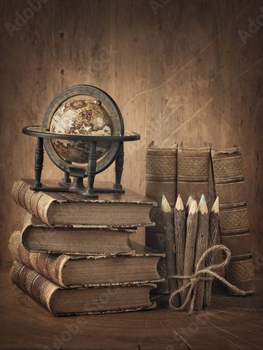 Stack of books and globe